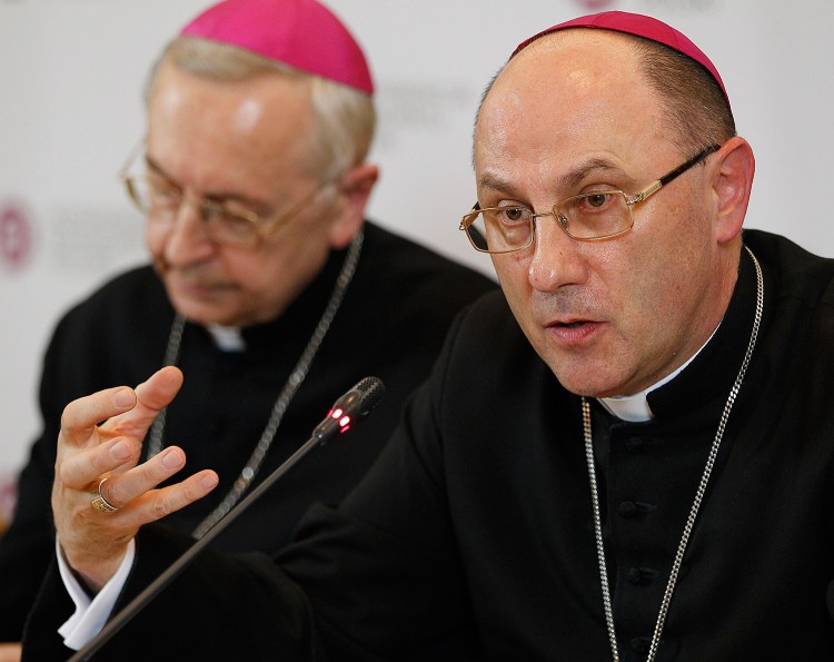 Archbishop Wojciech Polak, right, the Roman Catholic primate of Poland, addresses the media during a news conference in Warsaw, Poland, on Thursday. Poland's Catholic Church leaders revealed Thursday they have recorded cases of 382 priests abusing minors since 1990. At left is Archbishop Henryk Gadecki, the head of Poland's Roman Catholic Episcopate. 
