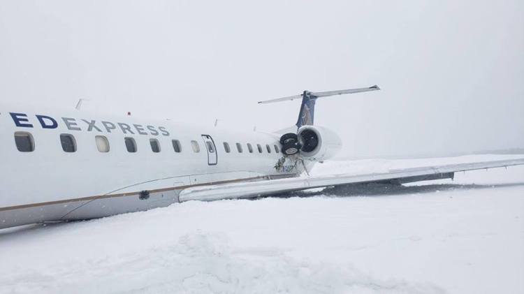 Five people were injured and a small jet was damaged when it slid off the runway at Presque Isle Airport on Monday.