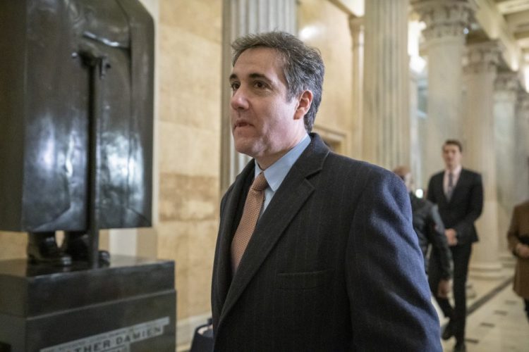 Michael Cohen, President Trump's former lawyer, returns to Capitol Hill for a fourth day of testimony as Democrats pursue a flurry of investigations into Trump's White House, businesses and presidential campaign, in Washington on Wednesday.