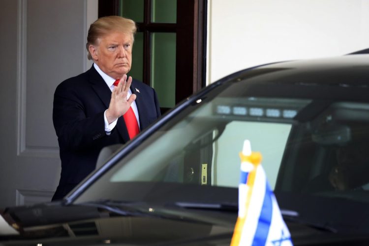 President Trump waves as Israeli Prime Minister Benjamin Netanyahu leaves the White House in Washington on Monday. 