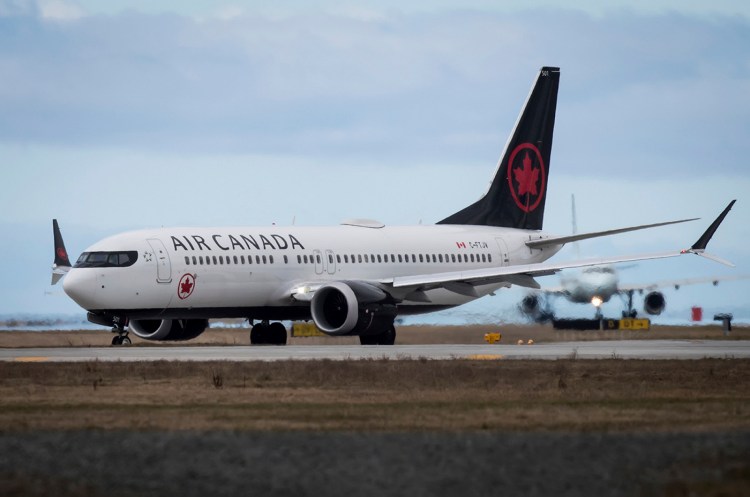Air Canada is looking into how crew members could have disembarked from a plane without noticing a sleeping passenger who was left behind.