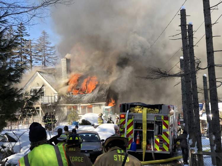 Firefighters battle a structure fire at Tenants Harbor on Friday.