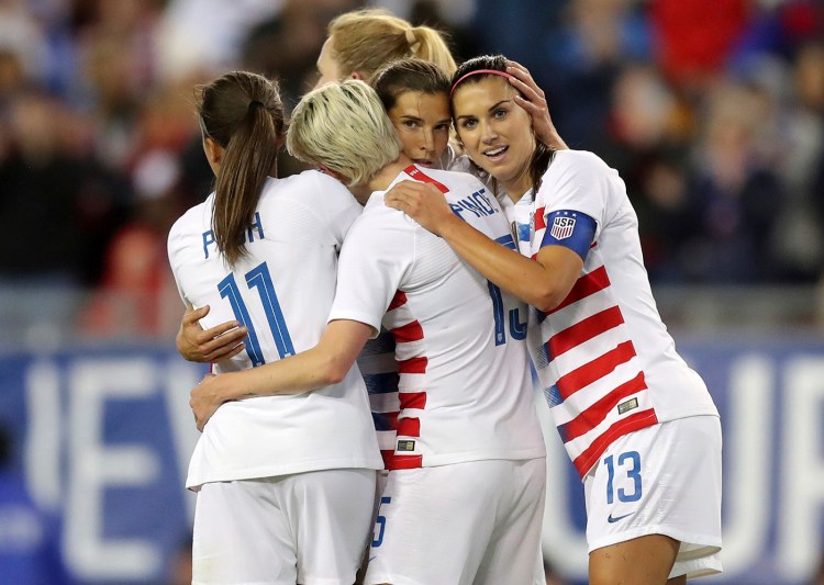 United States' Tobin Heath, second from right, is congratulated on her goal by Mallory Pugh (11), Megan Rapinoe and Alex Morgan (13) during the first half of a soccer match against Brazil on Tuesday in Tampa, Fla. 