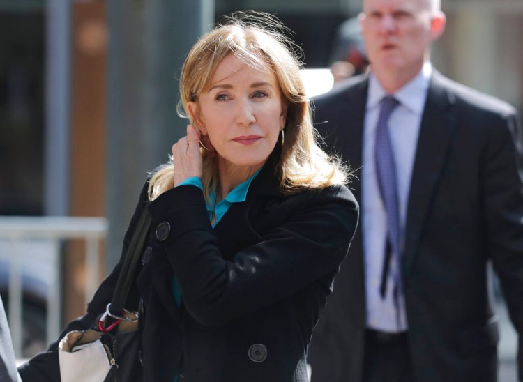 Actress Felicity Huffman arrives at federal court in Boston in April. U.S. Attorney Andrew Lelling's office urged a judge to sentence Huffman to one month of incarceration, 12 months of supervised release and a $20,000 fine.