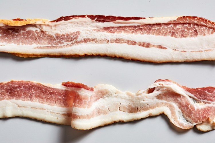 The bacon on top is packaged as uncured, the bacon on the bottom, cured. In truth, they're both cured.