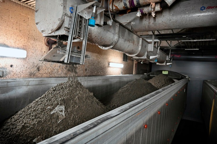 Sludge is dumped into a truck at the wastewater treatment plant in Portland in 2019.