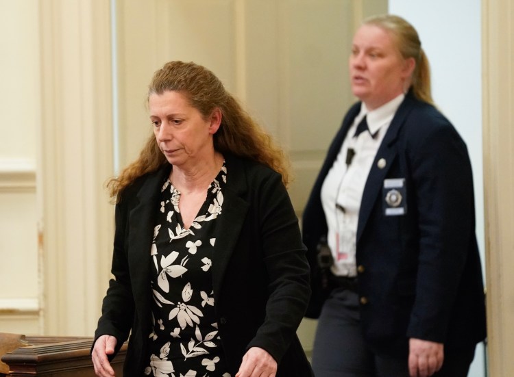 Carol Sharrow of Sanford, left, enters the courtroom Tuesday in York County Superior Court to face charges in last year's hit-and-run death of Douglas Parkhurst. Sharrow, who drove onto a baseball field in Sanford during a game in June, was committed to the Riverview Psychiatric Center as the judge found she has "an acute psychiatric illness."
