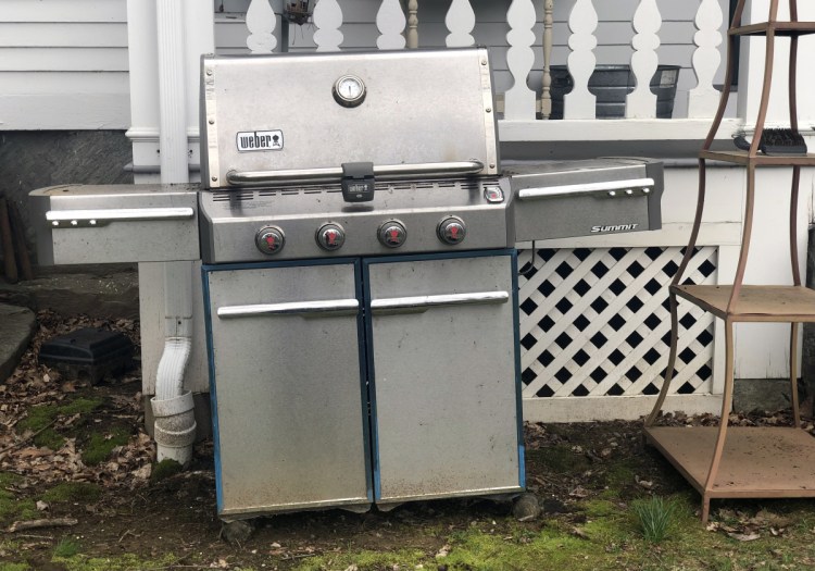 In this April 14 photo, a grill sits outside a home in New Milford, Conn., in need of some upkeep after sitting unused during the winter months.
