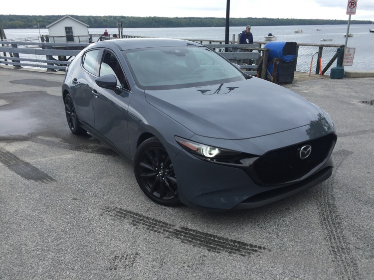 Mazda 3 prices range from $19,000 for base sedans to $31,335 for the Premium AWD Hatch reviewed. Photo by Tim Plouff. Location: Cousins Island ferry dock, Yarmouth. 
