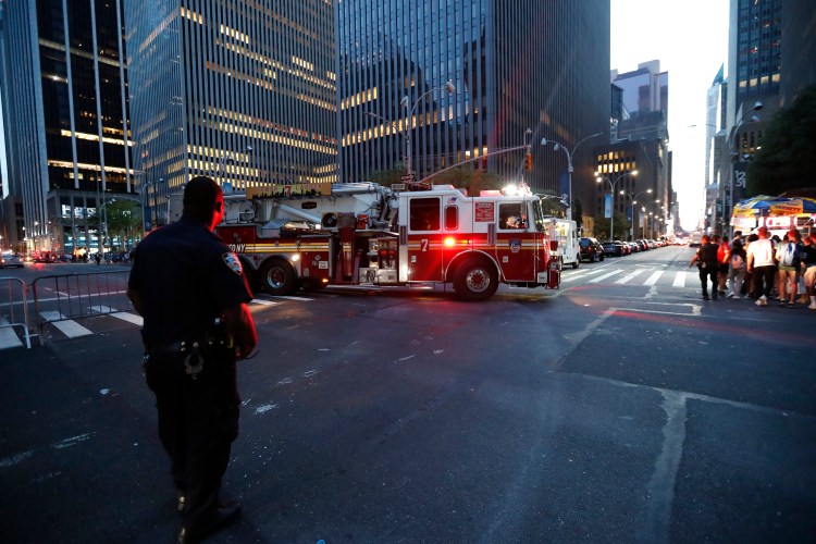 Fire trucks respond during a widespread power outage in the Manhattan borough of New York on Saturday.

