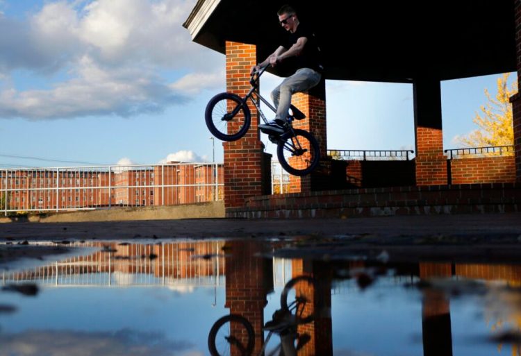 Dom Green, 17, of Saco, jumps over steps while riding with friends at Mechanics Park in Biddeford on Wednesday. Mechanics Park is at the corner of Maine and Water streets where you can see the Saco River and walk the paths. Or ride your bike. 