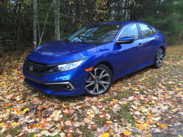 The Civic is definitely bigger but maybe not much better: Our reviewer's model of the Civic Touring Sedan is the same size as the Honda Accord of 12-15-years ago.