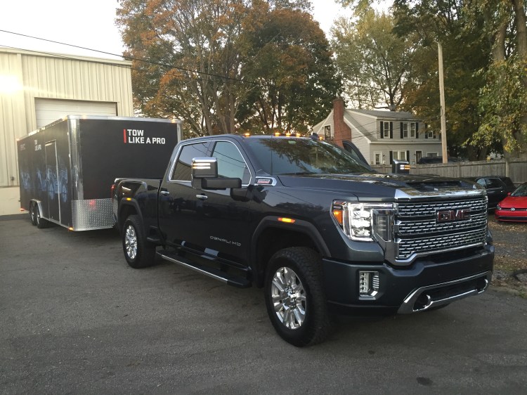 This sample Denali was hooked to a boxed car carrier, which had a brand new 2020 GMC Canyon pickup inside.