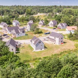 An aerial photograph of a Habitat for Humanity-built neighborhood in Scarborough on a sunny day.