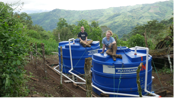 Steve Laudage (Pratt & Whitney) and Maeve Carlson (Wright-Pierce) top the newly installed water storage tanks above El Progreso, Ecuador.