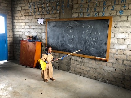 One of the Wagegen School children teaching our team numbers in Debre Birhan, Ethiopia.