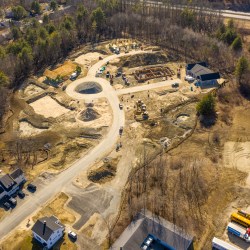 Aerial view of a construction site for Clover Way, a subdivision in West Falmouth