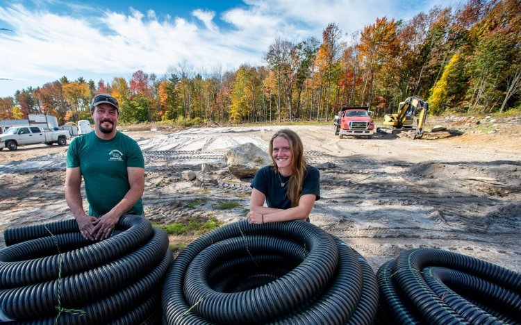 Michele Whitmore stands with contractor Deasy Edwards on Wednesday afternoon at her Underwood Farm in West Auburn. They are building a show ring, outbuildings and infrastructure for her horse farm. The horses are expected to move in next week.