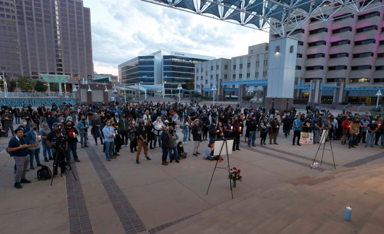 A large crowd of movie industry workers and New Mexico residents attend a candlelight vigil to honor cinematographer Halyna Hutchins in downtown Albuquerque, N.M. Saturday.