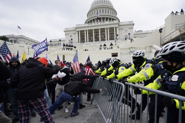 Trump supporters try to break through a police barrier at the Capitol in Washington on Jan. 6. A House committee tasked with investigating the Jan. 6 Capitol insurrection is moving swiftly to hold at least one of Donald Trump’s allies, former White House aide Steve Bannon, in contempt. 