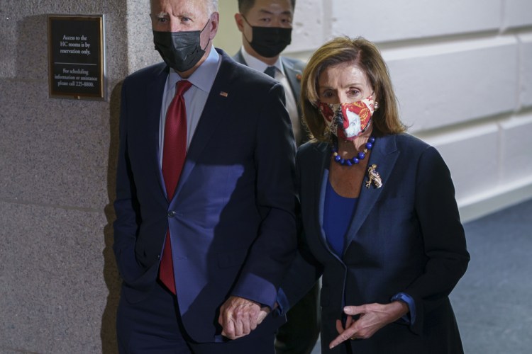President Biden and Speaker of the House Nancy Pelosi, D-Calif., shown this month, say Democrats are close to agreement on Biden’s domestic agenda.
