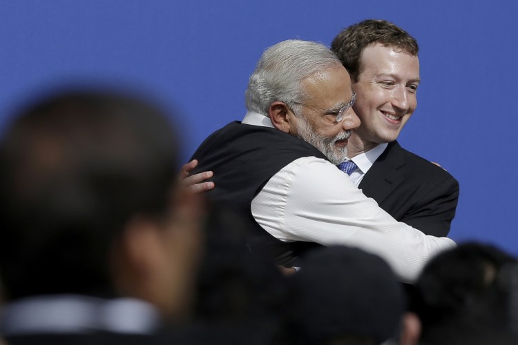 Facebook CEO Mark Zuckerberg, right, hugs Prime Minister of India Narendra Modi on Sept. 27, 2015, at Facebook in Menlo Park, Calif.