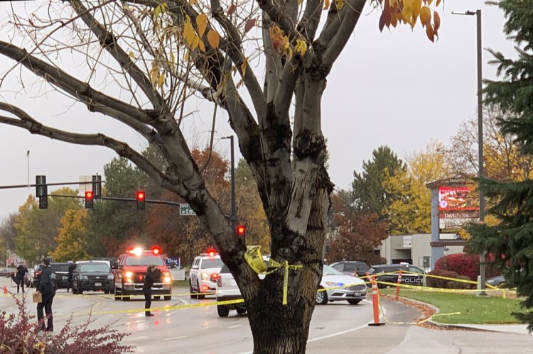 Police close off a street outside a shopping mall after a shooting in Boise, Idaho, on Monday.