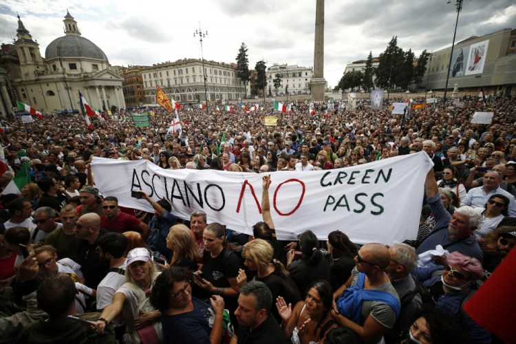 People gather in Piazza del Popolo square during a protest, in Rome on Saturday.

