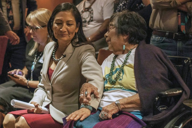 Congresswoman-elect Deb Haaland speaks to her mother, Mary Toya, following the news of her election during midterms' election night in Albuquerque, N.M. 