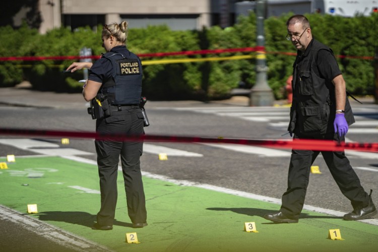 Police investigate fatal shooting in Portland, Oregon, in July. Oregon's largest city is on track to shatter its record of 70 homicides set in 1987. 