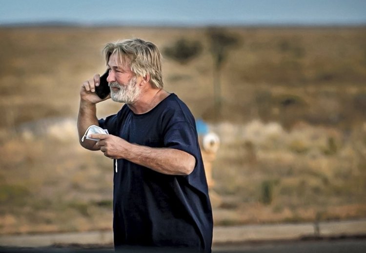 Alec Baldwin speaks on the phone in the parking lot outside the sheriff's office in Santa Fe, N.M., after he was questioned about a shooting on the set of the film "Rust." on Thursday.