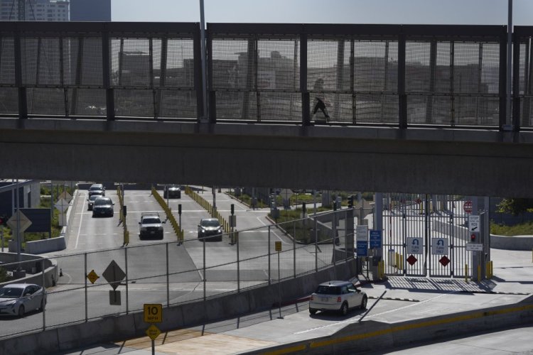 A few cars make their way north to cross into the United States from Tijuana, Mexico, Wednesday at the San Ysidro Port of Entry in San Diego. 

