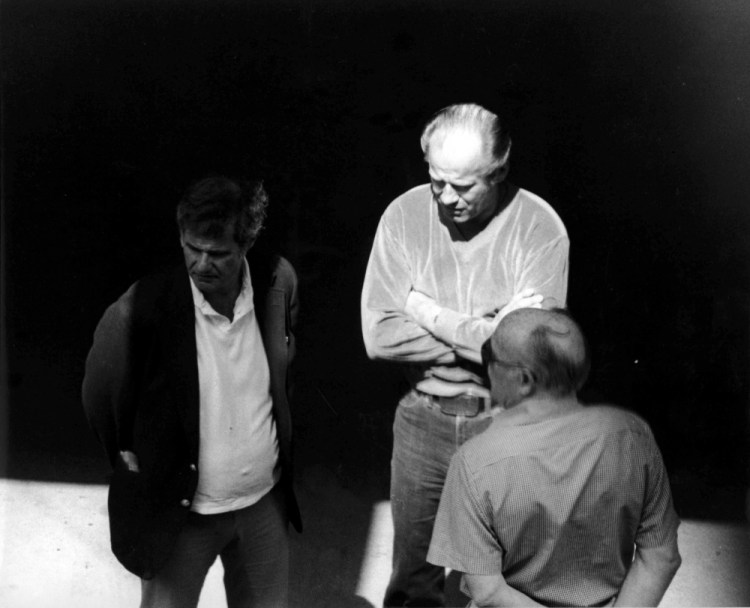This 1980 black and white surveillance photo, released by the U.S. Attorney's Office and presented as evidence during the first day of a trial for James "Whitey" Bulger in U.S. District Court in Boston in 2013, shows Bulger, center, with Ted Berenson, left, and Phil Wagenheim at a Lancaster Street garage in Boston's North End. Bulger was 89 when he was fatally beaten in October 2018. 