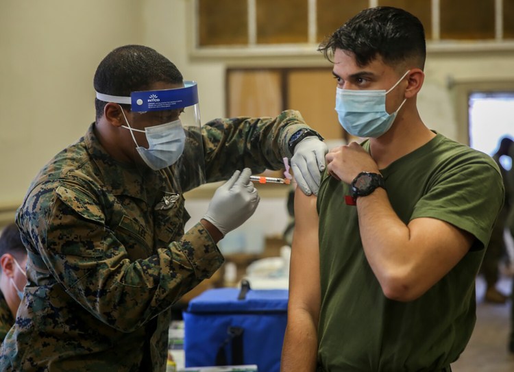 Military medical personnel at Camp Lejeune, N.C., administer coronavirus vaccines in January. The fact that vaccines are available for COVID is a blessing that should not be taken for granted, a reader says.
