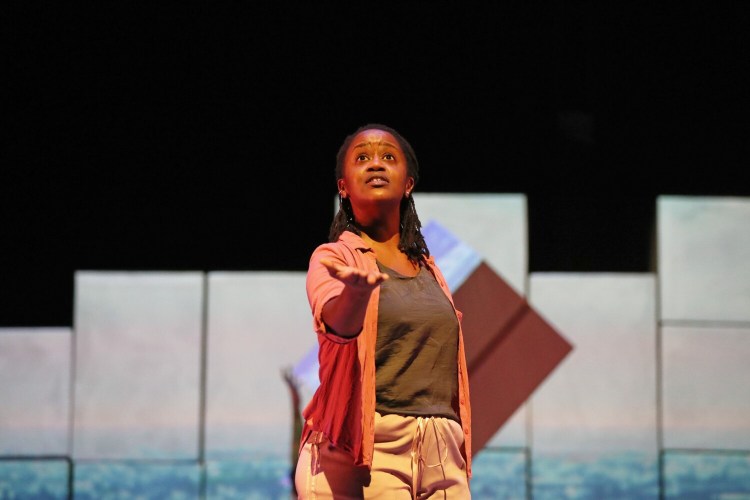 Malaika Uwamahoro, a Mainer who is a native of Rwanda, rehearses "Cartography" on Wednesday at the Merrill Auditorium. The play, which will be presented by Portland Ovations on Thursday night, includes Uwamahoro's migration story.