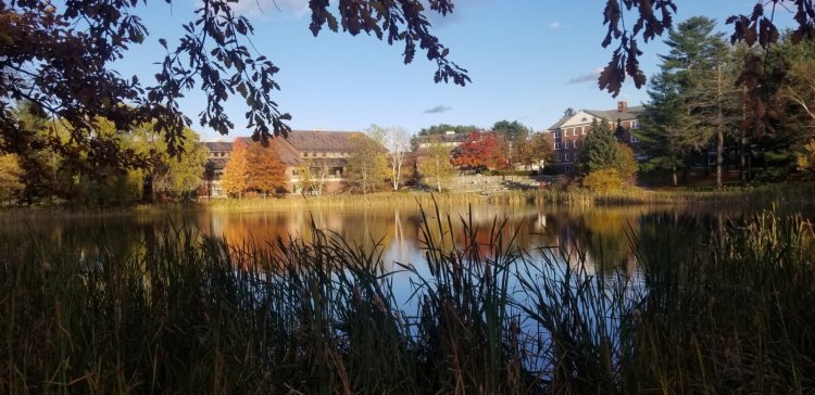 It may look tranquil at Bates College in Lewiston these days but behind the scenes there is a roiling debate among employees about whether to form a union. The campus is reflected in Lake Andrews.