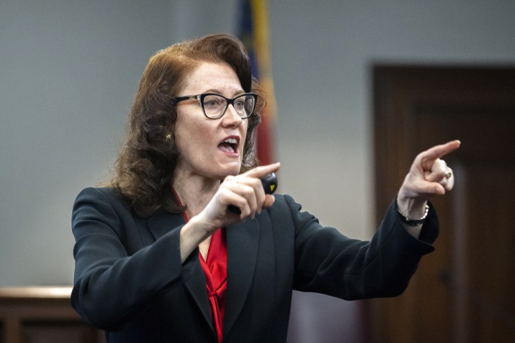 Prosecutor Linda Dunikoski presents a closing argument to the jury during the trial of Travis McMichael, his father, Gregory McMichael, and William "Roddie" Bryan, at the Glynn County Courthouse on Monday in Brunswick, Ga. The three men charged with the February 2020 slaying of 25-year-old Ahmaud Arbery. 