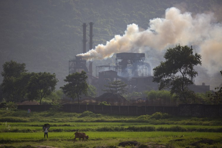 Smoke rises from a coal-powered steel plant at Hehal village near Ranchi, in the eastern state of Jharkhand, India ,on Sept. 26.

