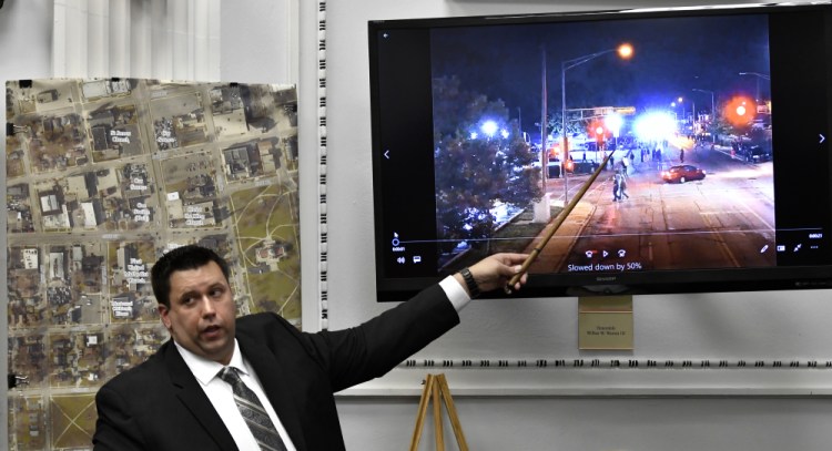 James Armstrong of the state crime lab points to drone video he digitally enlarged during Kyle Rittenhouse's trial at the Kenosha County Courthouse in Kenosha, Wis., on Tuesday.  Rittenhouse is accused of killing two people and wounding a third during a protest over police brutality in Kenosha, last year.   