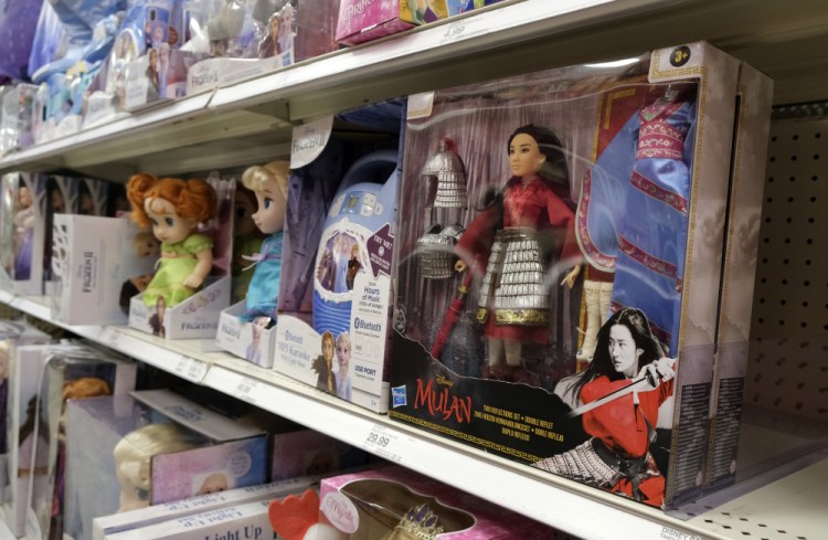 A "Mulan" doll is displayed in the toy section of a Target  store in Glendale, Calif. As supply chain bottlenecks create shortages on many items, some charities are struggling to secure holiday gift wishes from kids in need. They're reporting they can't find enough items in stock, or are facing shipping delays both in receiving and distributing the gifts. 
