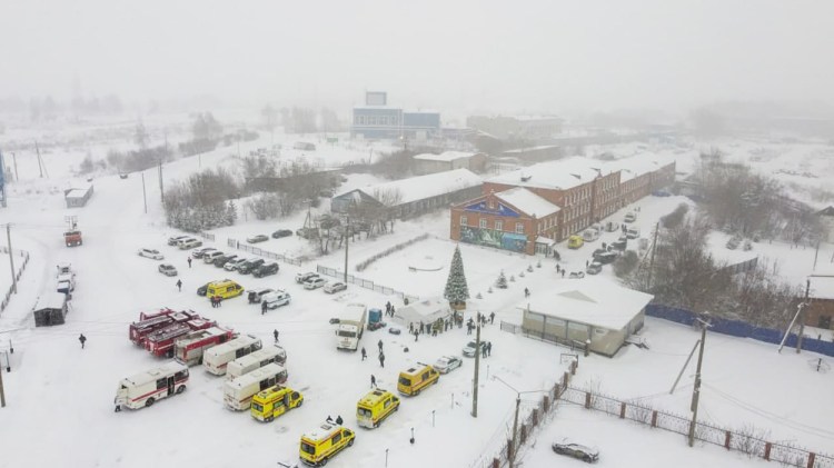 Ambulances and fire trucks are parked near the Listvyazhnaya coal mine out of the Siberian city of Kemerovo, about 1,900 miles east of Moscow, on Thursday. 