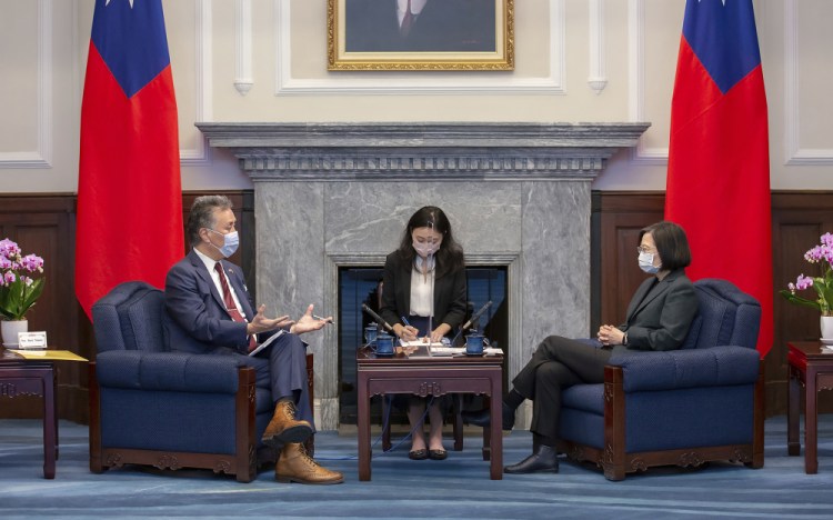 In this photo released by the Taiwan Presidential Office, U.S. Representative Mark Takano, D-Calif. left chats with Taiwanese President Tsai Ing-wen at the Presidential Office in Taipei, Taiwan on Friday, Nov. 26, 2021. 