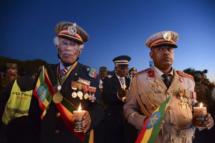 Current and former Ethiopian military personnel and the public commemorate federal soldiers killed by forces loyal to the Tigray People's Liberation Front at a candlelight event in Addis Ababa on Wednesday. 
