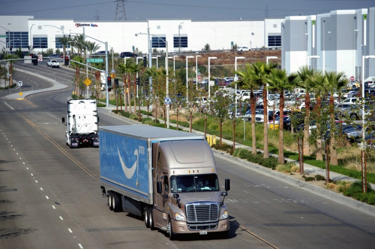 A semi-truck turns into an Amazon Fulfillment center in Eastvale, Calif. on Thursday, Nov. 12, 2020. 
