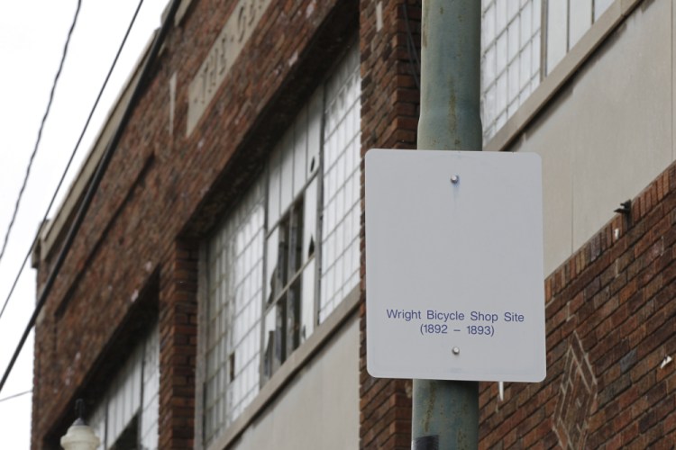 A sign notes the site of the Wright brothers' bike shop outside the former Gem City Ice Cream building in Dayton, Ohio.