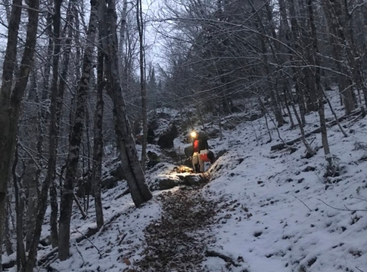 A Caribou woman was rescued at Aroostook State Park on Friday after she slipped and fell nearly 40 feet down a vertical drop.