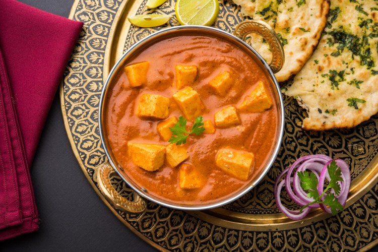 Paneer is used here in paneer butter masala, a popular Indian dish, often served at weddings or parties.