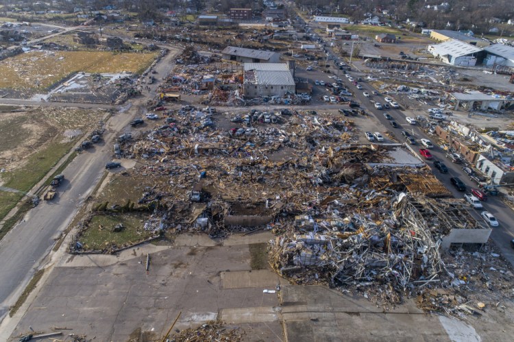 In this photo taken by a drone, buildings are demolished in downtown Mayfield, Ky., on Saturday, Dec. 11, 2021, after a tornado traveled through the region Friday night. 
