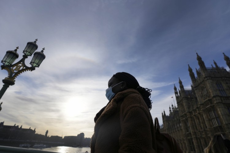 A woman crosses Westminster Bridge in London on Thursday. 