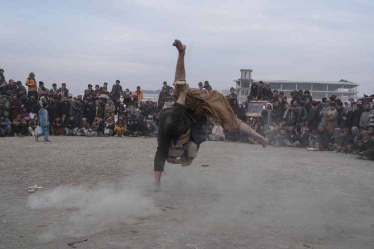 Afghan men wrestle in Kabul on Friday. Pahlawani provides a few hours of much anticipated entertainment.

 